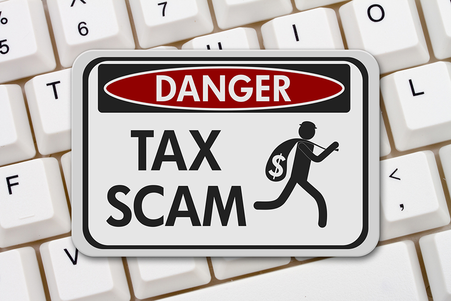 Danger sign warning of tax scam and fraud. Warning to secure and safeguard finances